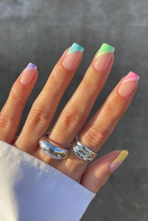 Take your nail game up a notch with this pastel gradient style. Although the gradient might be hard to spot from far away, it’ll serve as a surprise detail that earns you endless compliments. Plus, the rainbow hues add the perfect pop of color. Pastel Colour Tips Nails, Hard Gel Nails Design Summer, Multi Colour Nails, Rainbow Tip Nails, Nails Acrylic Pastel, Pastel Rainbow Nails, Pastel Nail Ideas, Pastel Nail Colors, Bella Nails