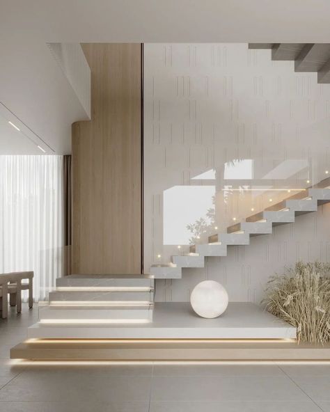 This living room area is so beautiful. We love all the details, the colors, and the gold appointments. What do you think? Small Floating Staircase, تحت الدرج, Staircase Interior Design, Staircase Designs, Staircase Design Modern, Stairs Design Interior, Stairs In Living Room, Stairs Design Modern, Stairway Design