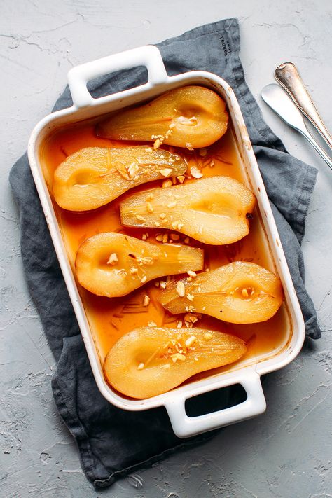 Pears roasted in a maple ginger syrup and served with a dollop of coconut cream. It's sweet, gingery, and super easy to make! Roasted Pears, Roasted Pear, Baked Pears, Ginger Syrup, Pear Recipes, God Mat, Fruit Recipes, Fruit Desserts, Vegan Desserts