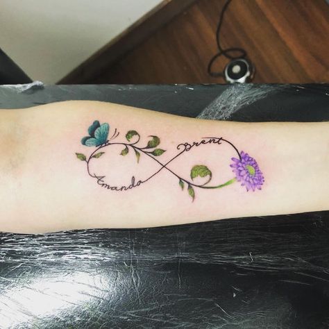 Butterfly Infinity Tattoo Ideas, Orchid Infinity Tattoo, Flower Infinity Tattoo Design, Infinity Butterfly Tattoo For Women, Butterfly Tattoo With Name In The Middle, Friend Infinity Tattoos, Butterfly Family Tattoo, Infinity Tattoo With Flowers, Butterfly Infinity Tattoo