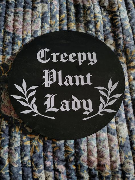 "Creepy Plant Lady Wall Decor. Handpainted with Vinyl.  Item is 10\"x10\". Choice of colors for vinyl. If the color you would like is not listed, please message me and I will do a custom color if available. The perfect addition to your horror decor! *Please note that there are plastic stands available for your item if you would like to put them on a shelf rather than hanging them. Please select \"with stand\" in the options if you would like one to be included with your order." Witchy Wall Art Prints, Creepy Cute Decor, Horror House Decor, Boho Goth Decor, Goth Farmhouse, Gothic Farmhouse Decor, Horror Home Decor, Creepy Home Decor, Horror Crafts