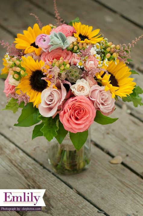 Pink Roses, Pink Spray Roses, Coral Roses, Pink Astilbe, Pink Ranunculus, Yellow Sunflowers, Hypericum Berries, White/Yellow Chamomile, Scabiosa Pods, Green Foliage>>>> Sunflower With Pink Flowers, Pink Sunflower Bouquet, Sunflower Pink Bouquet, Sunflower Wedding Bouquet Summer, Flower Bouquet Sunflower, Sunflowers And Roses, Sunflower Arrangements, Sunflower Wedding Bouquet, Coral Roses