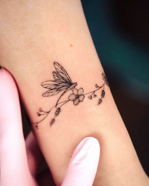 57 Stunning Dragonfly Tattoos With Meaning - Our Mindful Life Dragonfly Tattoos, Wrap Around Wrist Tattoos, Small Dragonfly Tattoo, Fineline Tattoos, Wrap Around Tattoo, Our Mindful Life, Flying Tattoo, Dragonfly Tattoo Design, Wrap Tattoo