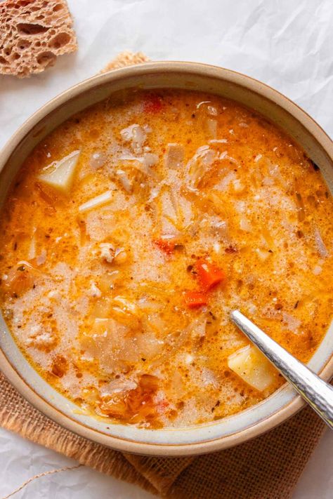 If you’re looking for a soup this fall or winter that’s comforting, filling, and slightly tangy, then give this Polish sauerkraut soup a try. Traditionally known as Kapusniak, it’s a tasty combination of tender pork ribs simmered in a rich broth, combined with the tangy sauerkraut and hearty potatoes. Serbian Soup Recipes, Vomacka Soup Recipe, Kapusniak Soup, Polish Sauerkraut, Tender Pork Ribs, Creamy Chicken Dinner, Greek Roasted Potatoes, Yummy Nummies, Lost Recipes