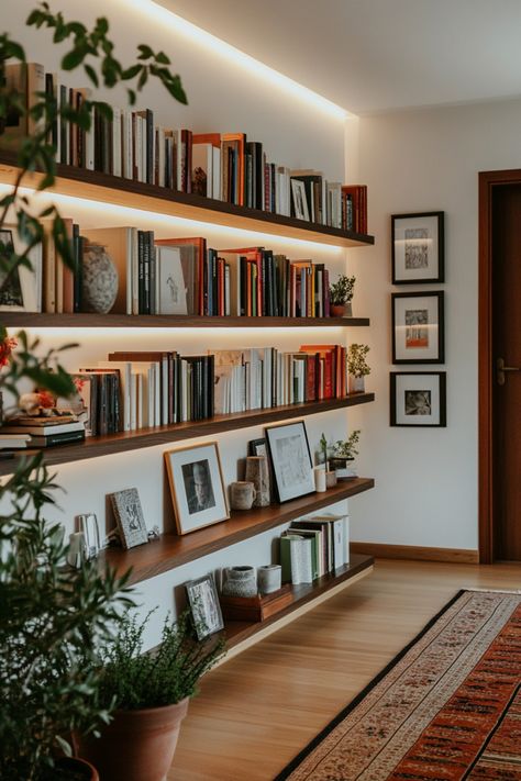 Turn your home office into a cozy home library with these tips and design ideas. Wall Shelf Library, Beachy Home Library, Library Wall Styling, Den Library Ideas, Floating Shelves Library Bookshelves, Library In The Bedroom, Library Room Minimalist, Book Shelf Diy Wood, Simple Home Library Ideas