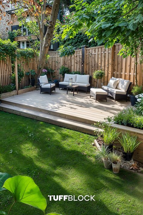 a beautiful yard with lush grass and a low level ground deck at the end, with outdoor furniture Deck In Corner Of Yard, Raised Backyard Deck Ideas, Ground Level Deck Ideas On A Budget, Small Yard Patio, Deck On The Ground, Garden With Decking, Simple Backyard Ideas, Patio Deck Ideas, Simple Backyard Landscaping