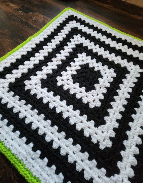 Cozy, comfy, and a little bit goth; Cuddle your little one with one of our alternative handmade crochet baby blankets! Perfect size for car seats, tummy time, and snuggling. Each blanket is made with acrylic yarn, measures 26 x 26 inches and takes approximately 1-2 weeks to complete. Beetlejuice Crochet Blanket, Halloween Crochet Blankets, Spooky Crochet Blanket, Crochet Halloween Squares, Goth Crochet Blanket, Crotchet Blankets For Beginners Easy, Granny Square Blanket Layout, Beetlejuice Crochet Pattern, Beetle Juice Crochet