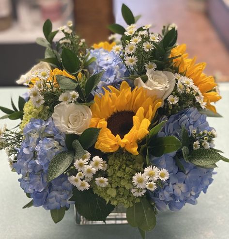 Sunflower And Blue Hydrangea Bouquet, Sunflower And Blue Centerpieces, Sunflower And Hydrangea Centerpieces, Sunflower And Blue Hydrangea Centerpieces, Blue And Yellow Flower Centerpieces, Dusty Blue And Sunflower Wedding Centerpieces, Blue And Yellow Flower Arrangements, Blue Hydrangea Centerpieces, Fall Sunflower Weddings