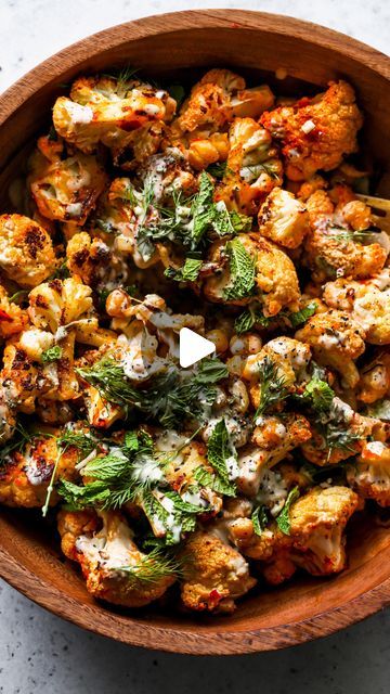 Jamie Vespa MS, RD on Instagram: "Harissa Roasted Cauliflower and Chickpeas with Lemony Tahini. A stunner of a side dish (or entree!) with the perfect alchemy of crunchy and creamy textures, and bold, vibrant flavor. Vegan, gluten free, and minimal effort yet big payoff.

Here’s what you need:
▢ cauliflower florets
▢ extra-virgin olive oil
▢ mild harissa (I use Mina brand)
▢ chickpeas
▢ shallots
▢ fresh torn herbs (I like a mix of mint and dill)
▢ tahini (I use Soom brand)
▢ fresh lemon juice
▢ garlic
▢ ground cumin

Click the link in my bio to access the recipe, or Google search “dishingouthealth harissa cauliflower”" Harissa Cauliflower, Vegan Roasted Cauliflower, Cauliflower And Chickpeas, Vegan Roast, Roasted Cauliflower, Shallots, Extra Virgin, Fresh Lemon Juice, Tahini