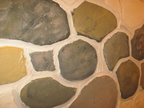 DIY Fake Stone Wall—Cheap and Fun! | Dengarden Faux Stone Painting Technique, Faux Stone Wall Interior, Faux Rock Walls, Fake Stone Wall, Stone Doorway, Faux Stone Walls, Diy Fireplace Makeover, Faux Rust, Fake Rock