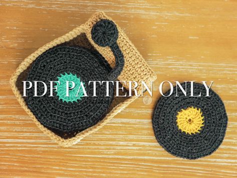 Spin Your Record Player Coasters is an advanced beginner crochet pattern to make a vinyl record player coaster set, life-size crochet vinyl's, vinyl purse, and vinyl cover. It is the perfect pattern for a beginner who is looking to advanced their crochet skills and knowledge! There are step-by-step photos where necessary, links to tutorials for beginners, and any helpful thoughts I could think of to help make this pattern easy to follow. Materials: 30-100yds of sport weight yarn 4.0mm crochet ho Crochet Record Coasters, Crochet Record Player, Crochet Vinyl Record, Whimsigoth Crochet, Crochet Room, Crochet Music, Grandma Era, Crochet Cup Coaster, Coaster Patterns