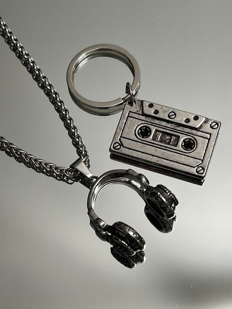 The ultimate present for him: A sleek Stainless Steel Vintage Cassette Keychain. Headphone pendant and 16" Chain option available.  Functional, Fashionable & Durable Men's Stainless Steel. Stainless Steel Vintage Cassette Keychain - Perfect Gift for the DJ, Musician, or Music Lover in your life. Amazing detail. Cassette  Length 1.5" Width 3/4" Headphone Length 1" Width 1" Chain 16" 3mm Whether you are buying for yourself or the man/woman in your life, this is going to be the piece that you/he/sh Dj Gifts For Men, Guy Keychain Ideas, Gifts For Musicians Boyfriend, Cool Key Chains, Headphone Keychain, Masc Jewelry, Music Related Gifts, Skateboard Jewelry, Cool Objects