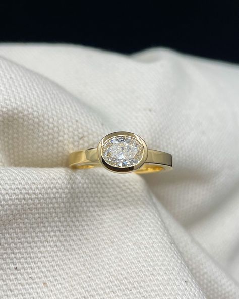 E approached us with the redesign of her cherished wedding and engagement rings.⁠ ⁠ For the engagement ring, we had the pleasure of using her captivating oval-cut diamond set horizontally to fit seamlessly alongside her bespoke wedding band.⁠ ⁠ E fell in love with our signature wedding band design from the start, which she wanted to incorporate sentimental diamonds from her mum into. So we carefully created a scatter of diamonds on a 4mm flat wedding band in 18ct Fairmined gold. Horizontal Oval Engagement Ring, Flat Wedding Band, Wedding And Engagement Rings, Oval Engagement Ring, Wedding Band Designs, Bespoke Engagement Ring, Oval Engagement, Band Design, Engagement Rings Oval