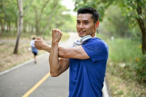 Happy Asian man in sportswear stretching his arms before running at a nature park stock photography Male Runner, Asian Man, Before Running, Handsome Asian Men, Nature Park, Health Technology, Body Poses, Stock Photography Free, Mens Sportswear