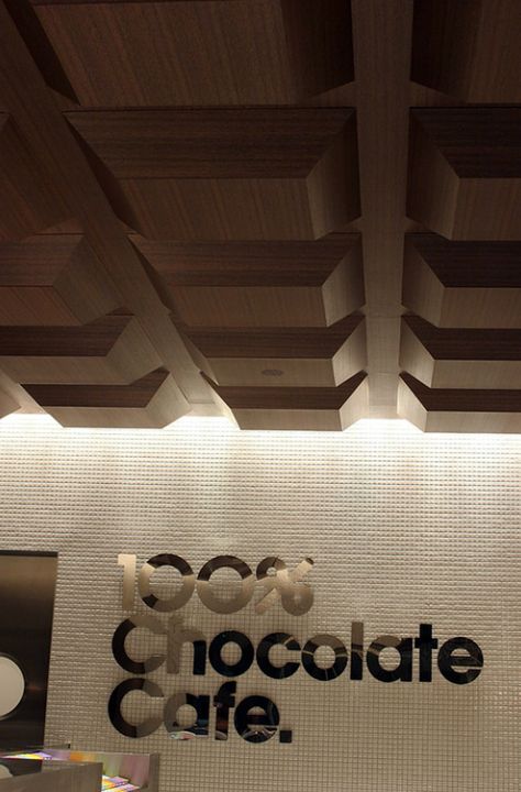 100% chocolate cafe is run by old Japanese chocolate brand, Meiji. The environment was designed by Masamichi Katayama of Wonderwall, while all the graphics were by Groovisions. Chocolate Pelo, Chocolate Store Design, Meiji Chocolate, Chocolate Boutique, Japanese Chocolate, Chocolate Stores, Chocolate Design, Graphic Projects, Chocolate Brands