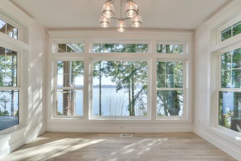 Coastal Waterfront | Coastal Waterfont Windows You Can See Out But Not In, Floor Ceiling Windows, Lake View Windows, Window With Transom Above, Wide Windows Living Room, Picture Window With Side Windows, Huge Windows Living Room, Sunken Sunroom, Wall Window Design