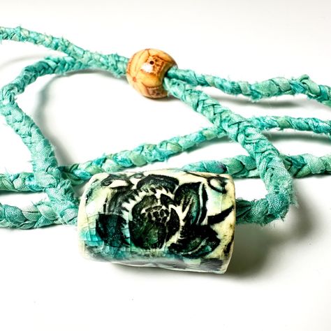 New Handmade Surly-Ramics Ceramic And Silk Adjustable Lotus Flower Barrel Bead Necklace Beautiful Turquoise Silk And Glaze Color. This Is A One Of A Kind Handmade Ceramic Barrel Bead And Upcycled Adjustable Silk Cord (Made From 100% Recycled Saree (Sari) Silk Ribbon.) The Ceramic Bead And Necklace Is Made By Me, Amy Davis Roth. I Make Each One By Hand And No Two Are Alike. It Has An All Natural Wooden Bead On The Back That Makes It Adjustable. This Is Handmade Boho At Its Best! This Necklace Has Sari Ribbon Jewelry, Sari Silk Jewelry, Ceramic Beads Necklace, Lotus Flower Necklace, Beach Jewelry Boho, Sari Silk Ribbon, Silk Jewelry, Ribbon Jewelry, Fiber Jewelry