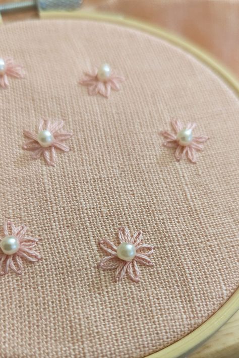 Pink daisy with pearl accent on pink linen, floral embroidery Pearl Bead Embroidery, Embroidery With Pearls, Pink Flower Embroidery, Dainty Embroidery, Painting Shoes, Sweatshirt Makeover, Hand Embroidery Patterns Free, Embroidery Lessons, Pearl Embroidery