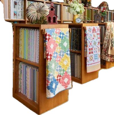 Quilt Shop Displays Craft Booths, Fabric Wall Storage, Fabric Shop Display Ideas, Quilt Shop Display Ideas, Quilt Store Display Ideas, Quilt Shop Ideas, Fabric Display Ideas, Fabric Display Ideas Showroom, Quilt Shop Displays