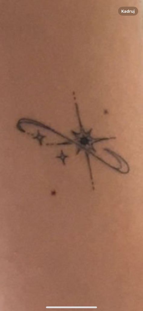 Rib Sparkle Tattoo, Spine Tattoos Astrology, Star Tramp Tattoo, Small Saturn Tattoo Design, Spine Tattoos Stars, Star Tattoo Spine, Star Lower Back Tattoos, Space Spine Tattoo, North Star Tattoo Design