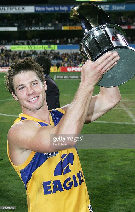 Ben Cousins #9 of the Eagles holds the Carlton Mid trophy after winning the round 20 AFL match between the West Coast Eagles and the Fremantle Dockers at Subiaco Oval on August 12, 2005 in Perth, Australia. West Coast Eagles Wallpaper, Ben Cousins, Eagles Hotel California, Fremantle Dockers, Funny Vintage Ads, West Coast Eagles, Australian Football, Hotel California, Magic Aesthetic