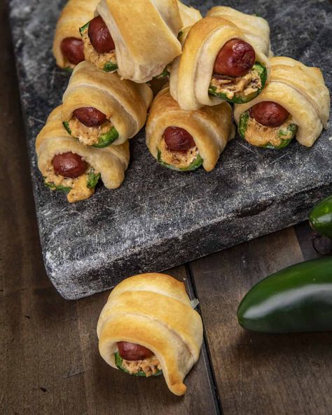 If jalapeño poppers and pigs in a blanket had a baby you would get these smoked jalapeño poppers pigs in a blanket! These cheese and bacon filled jalapenos, stuffed with a little smokie, wrapped in golden brown crescent dough, are hard to beat! Smoked Jalapeño Poppers Pigs In A Blanket, Jalapeño Popper Little Smokies, Smoked Pigs In A Blanket, Jalapeño Popper Pigs In A Blanket, Little Smokies Crescent Rolls, Recteq Recipes, Smoked Jalapeno Poppers, Jalapeno Poppers Crescent Rolls, Pigs In A Blanket Recipe