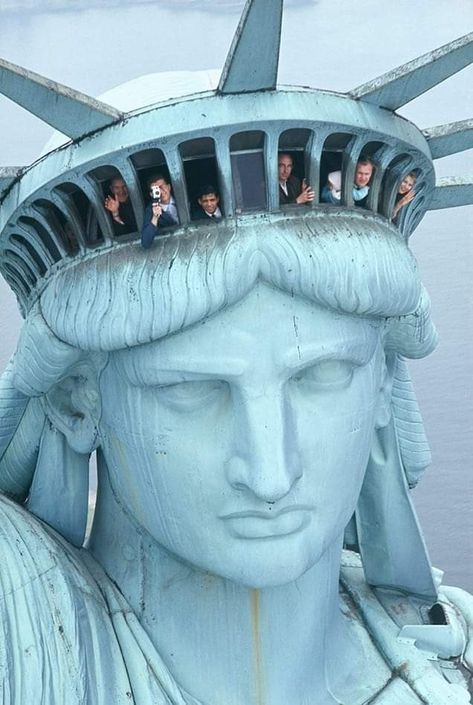 Tourists look out the windows on the Statue of Liberty's crown. No date given, but it looks like it could be early 1960s? Statue Of Liberty Crown, Liberty Island, Nyc Summer, New York Harbor, The Statue Of Liberty, Historic Photos, Lady Liberty, City That Never Sleeps, Historical Photos