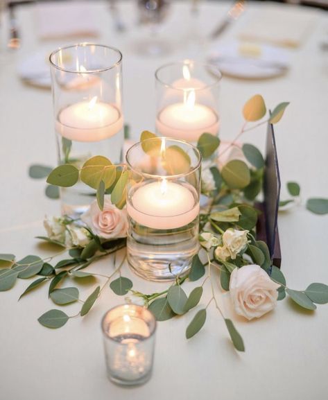 Simple laid greenery and florals around floating candles for reception Draw A Candle, Floating Candle Centerpieces Wedding, Simple Wedding Reception, Floating Candles Wedding, Vases For Centerpieces, Floating Candle Centerpieces, Greenery Centerpiece, Simple Wedding Centerpieces, Candle Wedding Centerpieces