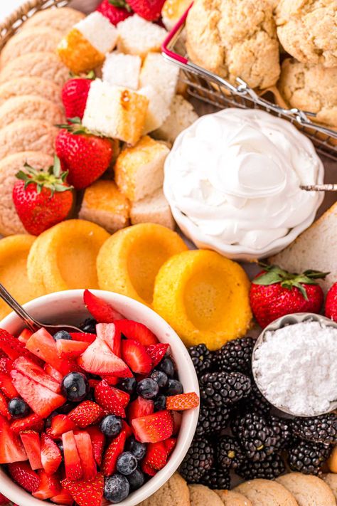 Shortcake Charcuterie Board is a delicious Build Your Own Shortcake experience that friends and family will have a ton of fun enjoying! Loaded with fresh fruit, cookies, whipped cream, and cake! Build Your Own Shortcake Bar, Make Your Own Shortcake Bar, Fruit Shortcake Desserts, Strawberry Shortcake Board, Strawberry Shortcake Charcuterie Board, Strawberry Shortcake Bar Make Your Own, Build Your Own Strawberry Shortcake Bar, Cake Charcuterie Board Ideas, Baked Goods Charcuterie Board