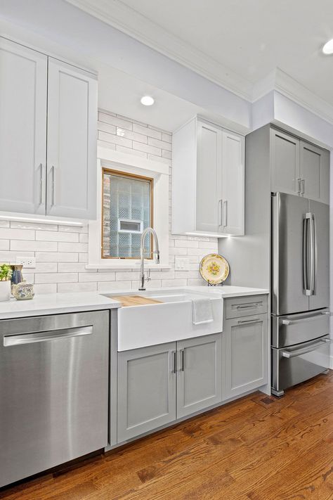 Grey Toned Kitchen Cabinets With White Subway Ceramic Backsplash Light Gray Kitchen Cabinets Shaker, Gray Kitchen Cabinets With White Quartz, Light Grey Cabinets Kitchen, Grey And White Kitchen Cabinets, Gray And White Kitchen Cabinets, Kitchen Cabinets Grey And White, Kitchen Cabinets Color Combination, Cabinets Colors, Light Grey Kitchens