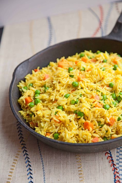 Tanzanian Coconut Rice With Peas and Carrots - Compassion Explorer Rice With Peas And Carrots, Pilau Rice Recipe, Recipes Using Coconut, Recipes Using Coconut Milk, Rice With Peas, Mix Vegetable Recipe, Slow Cooker Scalloped Potatoes, Green Bean Casserole Crock Pot, Pilau Rice