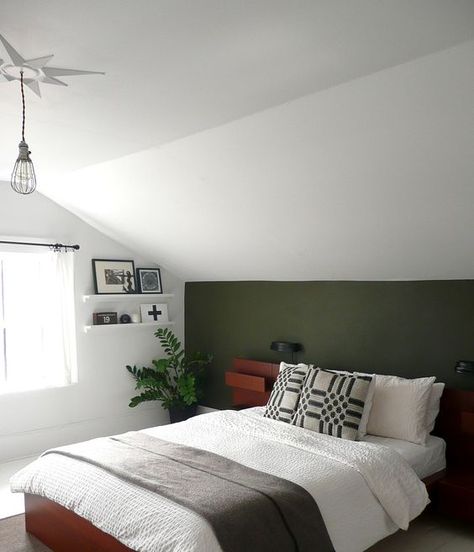 Army green paint color adds a touch of spunk to this room, I love it! Sloped Bedroom Ideas, Sloped Ceiling Bedroom Master Suite Slanted Walls, Attic Paint Ideas Sloped Ceiling, Sloped Bedroom Ceiling, Green Attic Bedroom, Army Green Bedroom, Attic Bedroom Designs Angled Ceilings, Army Green Paint, Slanted Ceiling Bedroom