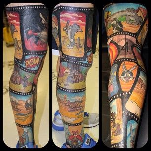 This reel tattoo highlights everyone’s favorite Tunes. | 23 Insanely Intricate Leg Sleeve Tattoos Cartoon Legs, Tom Und Jerry, Full Leg Tattoos, Comic Tattoo, Devil Tattoo, Kunst Tattoos, Cartoon Character Tattoos, Theme Tattoo, Back Of Shoulder Tattoo