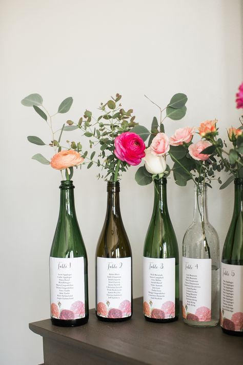 wine bottle + seating chart Wine Bottle Seating Chart, Bottle Seating Chart, Wine Bottle Flowers, Decorations On A Budget, Wine Bottle Vases, Wedding Decorations On A Budget, Spring Wedding Decorations, Wedding Floral Centerpieces, Wine Wedding