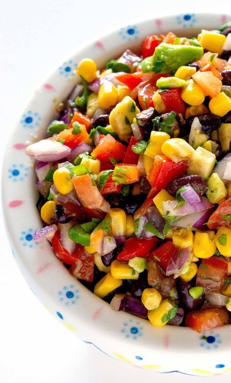 Black Bean and Corn Salad is a zesty side dish or appetizer that is packed with corn, black beans, tomatoes, red bell pepper, jalapeño, avocado, cilantro, and lime zest. Corn Bean Salad, Corn And Bean Salad, Black Bean And Corn Salad, Bean And Corn Salad, Black Bean Corn Salad, Black Bean Salad Recipe, Hawaiian Macaroni Salad, Black Bean And Corn, Bean Salad Recipe