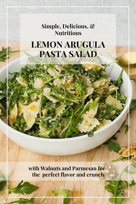 background image shows white bowl containing lemon and arugula pasta salad with bowtie shaped pasta. It sits on a light brown cutting board. Text overlay reads "Simple, delicious, and nutritious Lemon Arugula Pasta Salad with Walnuts and Parmesan for the perfect flavor and crunch." Lemon Arugula Pasta, Arugula Pasta Salad, Arugula Pasta, Arugula, Summer Salads, Delicious Salads, Gnocchi, Soup And Salad, Healthy Lunch