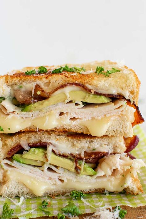 The best turkey sandwich -grilled with bacon and avocado. Plus 10 ideas of what to put on turkey sandwiches. Everything from a classic turkey sandwich, a turkey sandwich with cranberries, and with Thanksgiving leftovers. We like to call them turkey melts, or grilled turkey cheese sandwiches! Deli Turkey Sandwich Recipes, Fancy Turkey Sandwiches, Turkey Gobbler Sandwich, Sandwich Rollups, Turkey Sandwich Ideas, Turkey Supreme, Turkey Melt Sandwich, Turkey Breast Sandwich, Turkey Melts