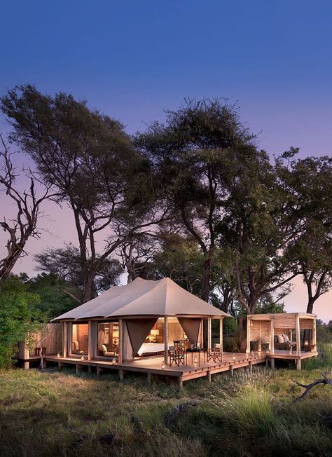 &Beyond Nxabega Okavango Tented Camp has nine luxurious suites, including a family unit comprised of two suites joined by a deck. Each room has both indoor and outdoor showers as well as an outdoor sala, perfect for cool afternoon naps or between-activity game viewing. Slightly elevated, overlooking a lagoon frequented by hippo and elephants, each room offers the utmost in vistas and privacy. Luxury at it's best. Timbuktu Travel. Chobe National Park, Tented Camp, Lodge Design, Lodge Ideas, Indoor Camping, Tent Living, Tent House, Glamping Ideas, Eco Resort