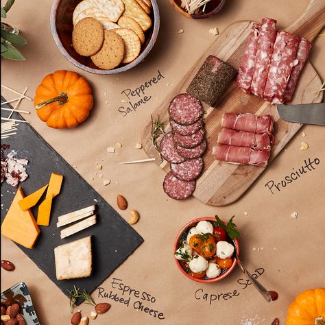 Here's a fresh idea. Use kraft paper instead of a tablecloth to add a modern flair to you holiday table. Party Food Spread, Paper Tablecloth, Paper Table, Holiday Table, Grad Parties, Holiday Tables, Kraft Paper, Party Food, Cheese Board