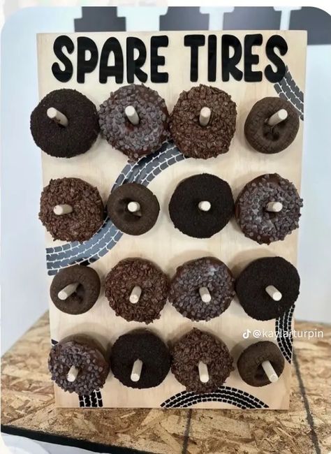 Spare Tire Donut Sign, Donut Spare Tire, Car Donuts Spare Tires, Tire Party Decorations, Old Truck Theme Birthday Party, Mindy Weiss Birthday Party, Tire Donut Diy, Cars And Trucks Birthday Party Decorations, Spare Tire Donut Wall