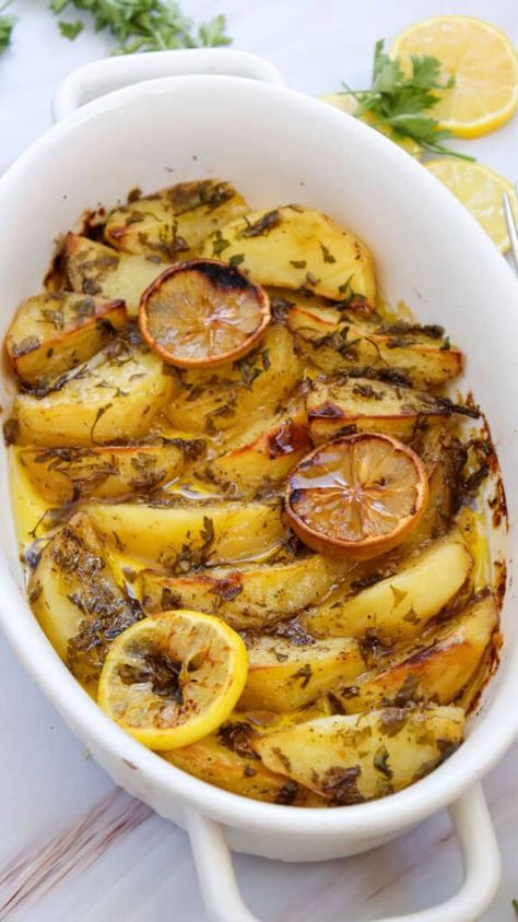 Greek Lemon Potatoes are perfectly roasted in a lemon, oregano, and garlic broth resulting in a tender, flavorful side dish. This easy potato recipe is a delicious side dish that adds a Mediterranean twist to any meal. Greek Oven Potatoes, Lemon Greek Potatoes, Greek Side Dishes, Greek Style Potatoes, Garlic Broth, Greek Roasted Potatoes, Cookie Mix In A Jar, Lemon Roasted Potatoes, Greek Dinner