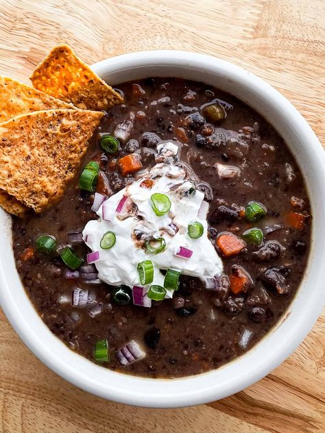 This simple black bean soup recipe uses canned black beans–making for a quick prep since you don’t need to soak the beans. The soup is flavorful and you can adjust the heat-level to suit your tastes. Slow cooker variation included. There’s a lot to love about this soup. I’ve been making the recipe for almost...Read More Black Bean Soup Recipe Using Canned Beans, Black Bean Soup With Bacon, Quick Black Bean Soup, Simple Black Bean Soup, Ham Black Bean Soup, Soup Black Bean, Ham And Black Bean Soup Recipes, Beef And Black Bean Soup, Black Bean And Rice Soup