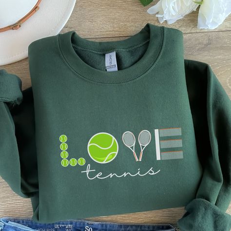 The coziest tennis sweatshirt out there. Perfect for the tennis player in your life, with this awesome crewneck sweatshirt- the perfect gift for a tennis lover. Please be aware that due to the nature of the fabric as well as the screen on your laptop or mobile devices, colors may differ slightly when you receive them in person. Since each item is made to order and is not created until you place your order, I do not accept returns or exchanges. Please be sure to take a look at the size and color Tennis Crewneck, Tennis Sweatshirt, Tennis Sweater, Tennis Aesthetic, Tennis Party, Tennis Life, Tennis Gifts, Sports Aesthetic, Tennis Club