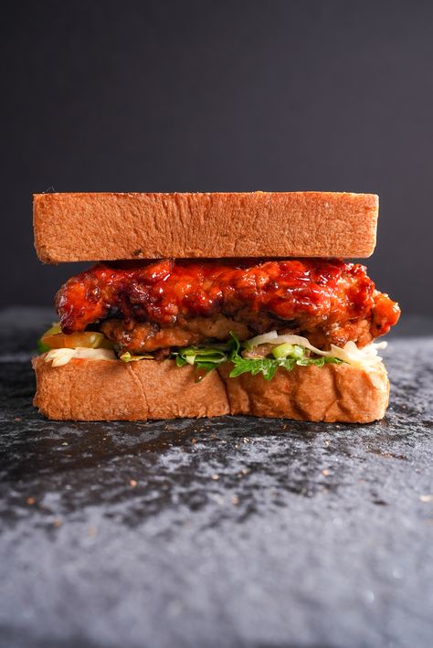 Korean Fried Chicken Sandwich Korean Chicken Sandwich Recipes, Korean Fried Chicken Sandwich, Korean Sandwich, Barbeque Sandwiches, Kimchi Slaw, Shiso Leaves, Ultimate Sandwich, Sticky Sauce, Sandwhich Recipes