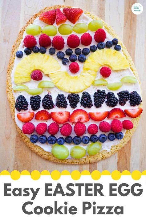 Learn how to bake and design a delicious Easter egg fruit pizza - with a sugar cookie base and an easy fruit spread recipe. This is a showstopper Easter dessert idea! #cookiepizza #easterdessert #eastercookie #easterfruittray Easter Egg Fruit Tray, Egg Shaped Fruit Pizza, Easter Egg Fruit Pizza Recipe, Easter Fruit Pizza, Sugar Cookie Recipe For Fruit Pizza, Egg Fruit Pizza, Fruit Spread Recipe, Easter Fruit Tray, Easter Pizza