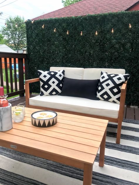 chic outdoor space. black and white deck inspiration Back Porch Greenery Wall, Outdoor Accent Wall Patio, Deck Accent Wall, Patio Greenery Wall, Boxwood Patio Wall, Boxwood Wall Behind Tv, Boxwood Accent Wall, Patio Accent Wall, Faux Boxwood Wall Outdoor