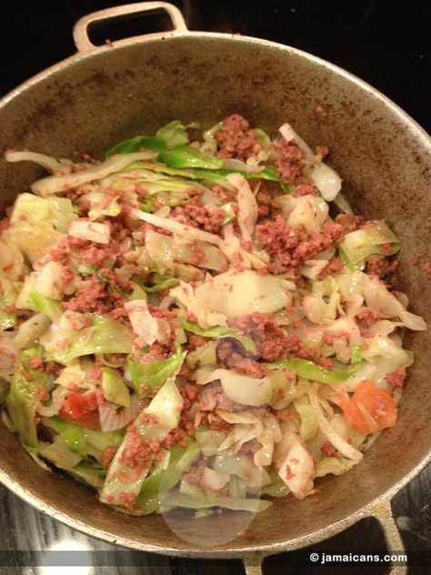 Corn Beef and Cabbage which is also known as Bully Beef and Cabbage is one of those â€œlazyâ€ one-pot Jamaican meals that is cooked when you are on the go. It is said to be a favorite of single men because of how easy it is to cook. Please be aware that the corn beef mentioned in this recipe is not the sliced corn beef that is typically seen in sandwich delis outside of the Caribbean but it is from a can.  Jamaica and much of the English Speaking Caribbean call it bully-beef.  Enjoy our Bully B Canned Corned Beef Recipe, Bully Beef, Canned Corned Beef, Jamaica Food, Beef Cabbage, Corn Beef, Oxtail Recipes, Jamaican Dishes, Beef And Cabbage