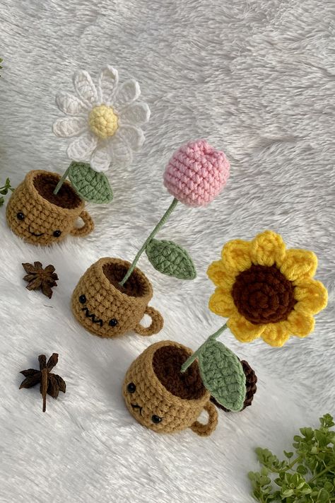 CROCHET IDEAS : Easy Crochet Mini Pot Tutorial | Pretty Crochet Mini Flower Sunflower + Crochet Daisy + Crochet Tulip 💕🌷 #crochettutorial #crochetflower #crochetideas Materials: 1. Cotton yarn 4ply size 2 mm. 2. Crochet hook No.4 size 2.5 mm. 3. Crochet hook No.5 size 3 mm. 4. Eyes 6 mm. 2 pcs. 5. Wire length 12 cm. 6. Polyester fiber 7. Scissors 8. Needle Finished size: Height 15 cm. Width 6 cm. Crochet Mini Flower Pot, Crochet Tulip, Sunflower Crochet, Daisy Crochet, Sunflower Daisy, Mini Sunflowers, Flower Sunflower, Pretty Crochet, Crochet Daisy