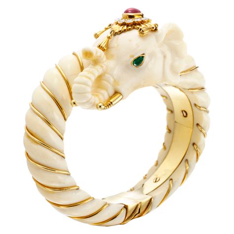 VAN CLEEF & ARPELS A Multi-Gem, Ivory and Gold 'Elephant' Bangle | From a unique collection of vintage bangles at http://www.1stdibs.com/jewelry/bracelets/bangles/ Ivory Elephant, Elephant Bangle, Cabochon Ruby, Van Cleef And Arpels Jewelry, Emerald Eyes, Gold Elephant, Elephant Bracelet, Bracelets Design, Antique Jewelry Indian