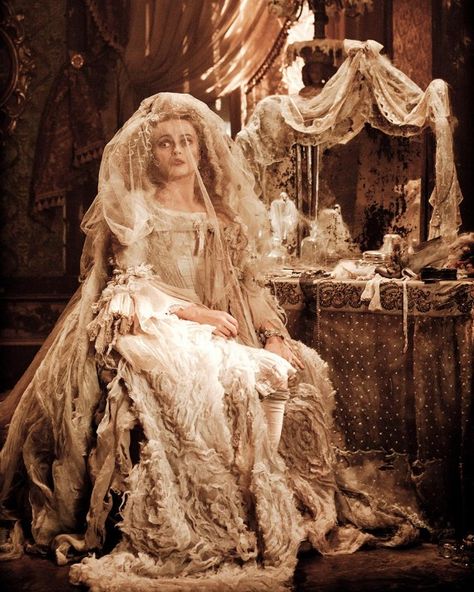 No list of movie wedding dresses would be complete without Miss Havisham (Helena Bonham Carter)'s theatrical gown in 2012's Great Expectations, for which costumer Beatrix Aruna Pasztor looked both to history and modern runway for inspiration. "I was very much influenced by Alexander McQueen's SS13 oyster dress. It's simple but beautiful and a wonderful example of how material can be used and layered to create a dramatic silhouette," Pasztor told Stylist. "What I wanted to create was a f... Movie Wedding Dresses, S Wedding Dress, Marla Singer, Miss Havisham, Crystal Wedding Dress, Wedding Movies, Helena Bonham, Bellatrix Lestrange, Bonham Carter